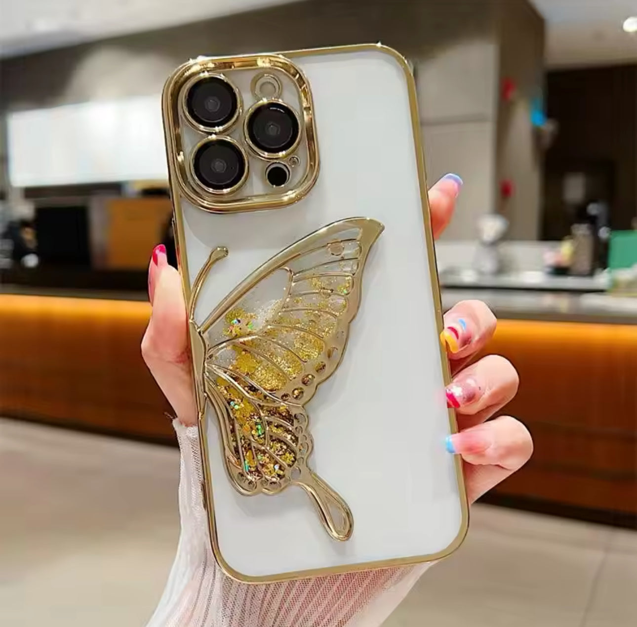 Carcasa Mariposa y brillos dorada