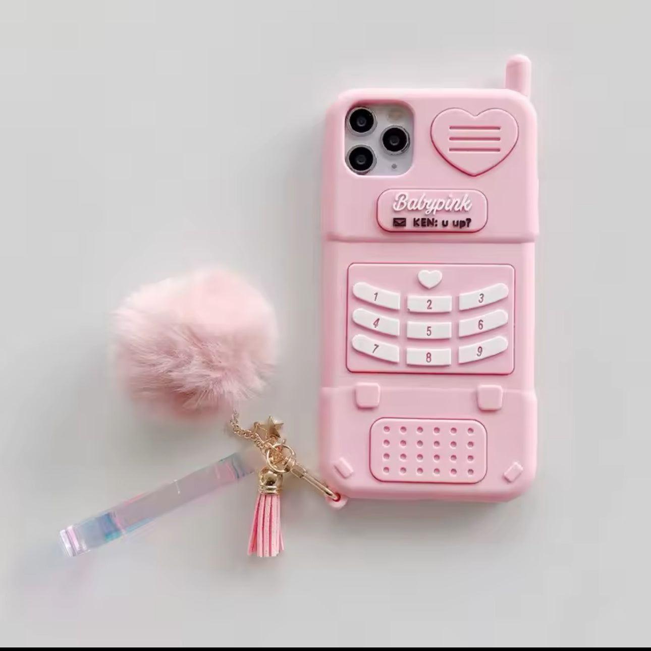 Carcasa teléfono rosada, Silicona , con pompom